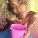 As part of a custom video, a pretty, slender, black girl takes a shit into a miniature, plastic bucket. She shows us her dirty asshole, then holds the bucket up to the camera for a closer look at her turds inside. About 6.5 minutes.
